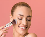 Model using multi-purpose makeup brush